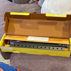 On Running Yellow and Black TV Stand